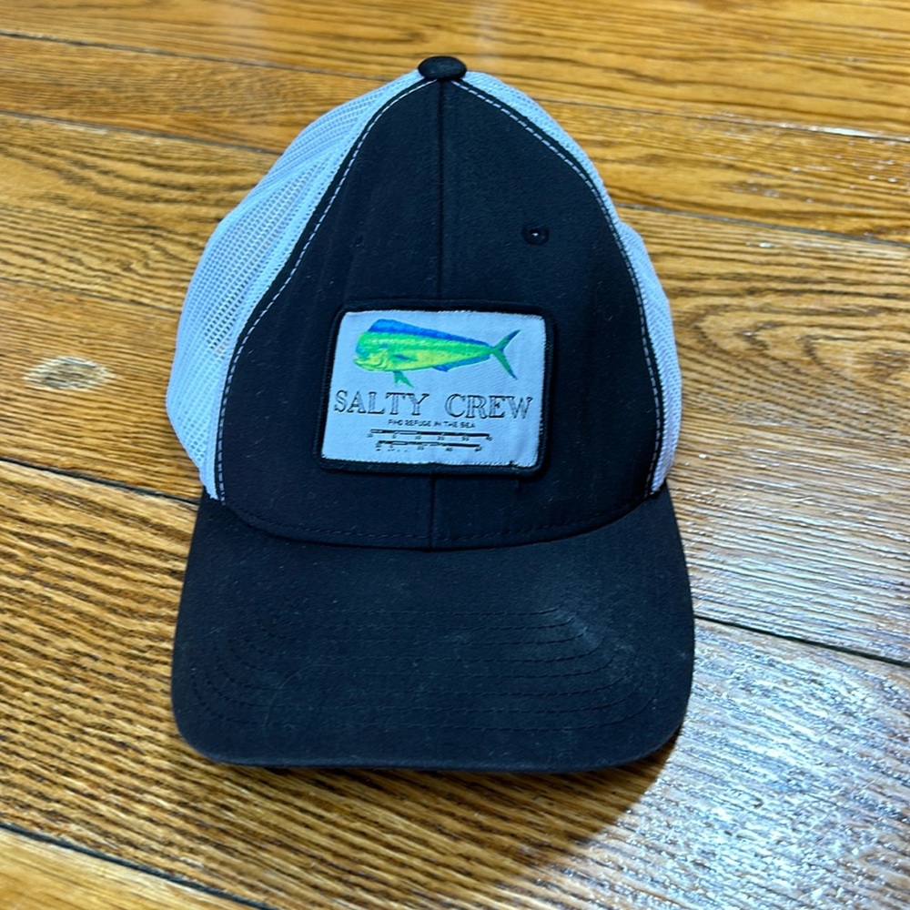 Salty Crew truckers snap back style cap. White mesh back with black front.